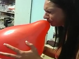 Balloon Blowing Teen with Big Tits